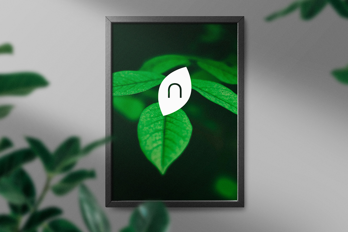 Clean minimal frame mockup on the wall with leaves